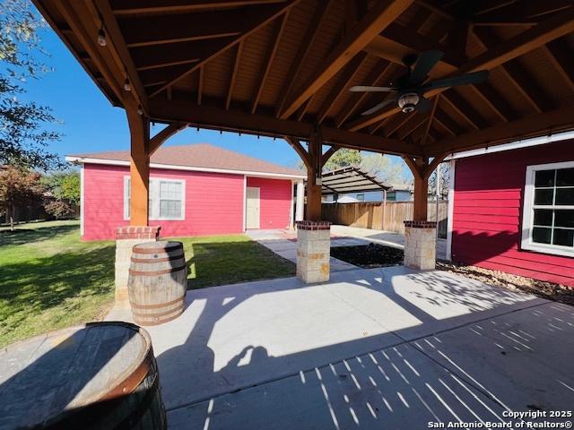 view of patio featuring a gazebo and ceiling fan