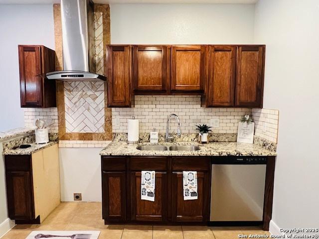 kitchen featuring dishwasher, tasteful backsplash, wall chimney exhaust hood, and sink