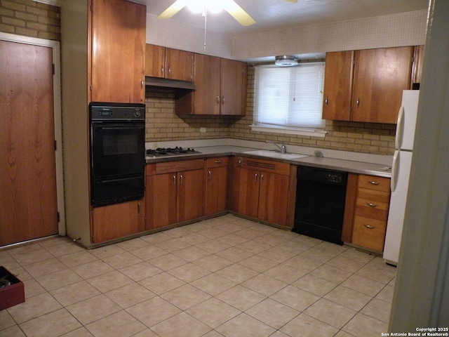 kitchen with backsplash, ceiling fan, sink, and black dishwasher