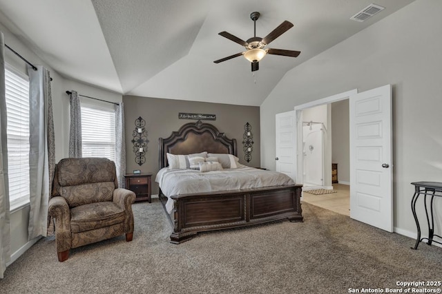 bedroom featuring light colored carpet, vaulted ceiling, and ceiling fan