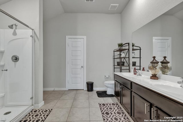 bathroom featuring tile patterned floors, vanity, a shower with shower door, and lofted ceiling