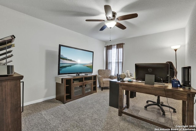 office with carpet flooring and ceiling fan