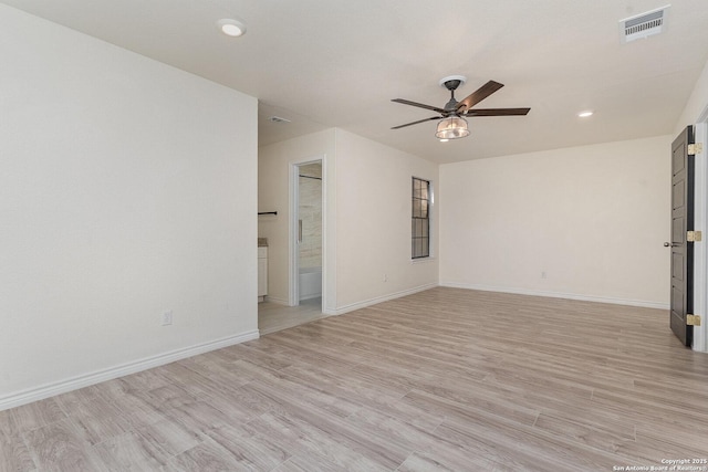 unfurnished room with ceiling fan and light hardwood / wood-style floors