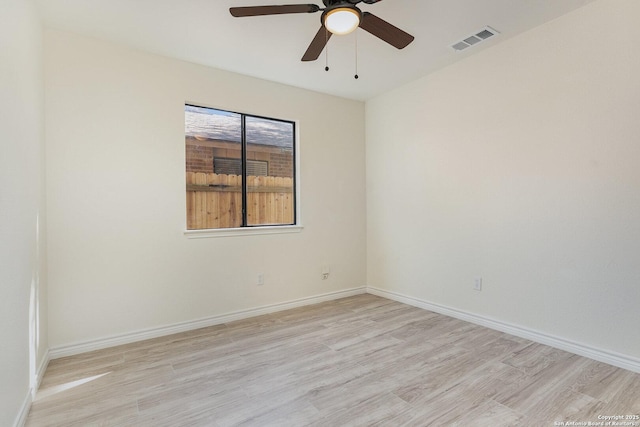 spare room with light hardwood / wood-style flooring and ceiling fan