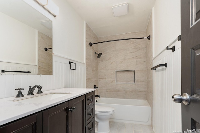 full bathroom with vanity, toilet, and tiled shower / bath