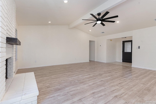 unfurnished living room featuring a fireplace, light wood-type flooring, vaulted ceiling with beams, and ceiling fan