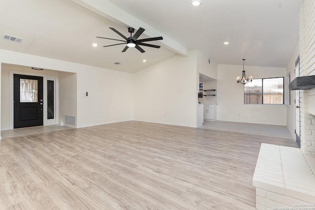 unfurnished living room with ceiling fan with notable chandelier, lofted ceiling with beams, and light hardwood / wood-style flooring