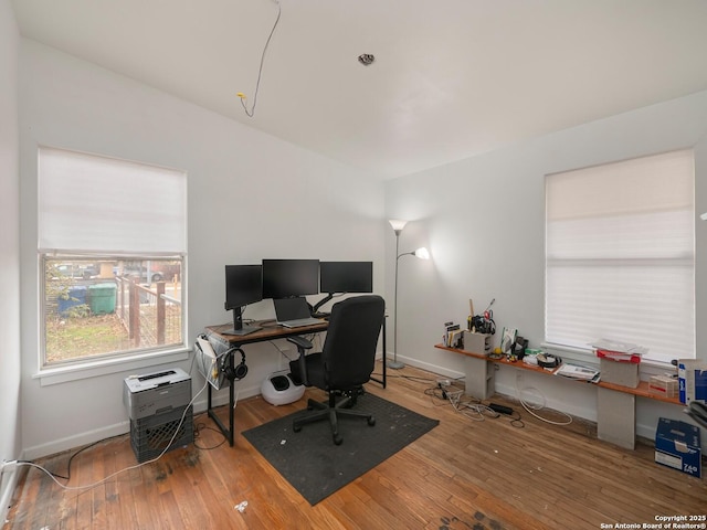 home office with hardwood / wood-style floors