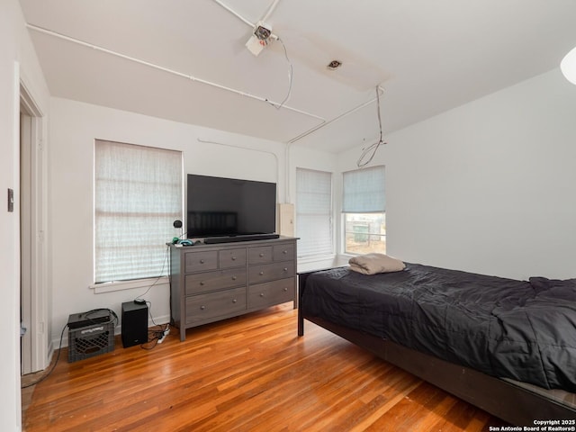 bedroom with light hardwood / wood-style floors