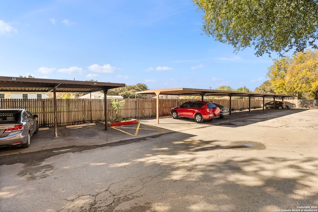 view of parking / parking lot with a carport