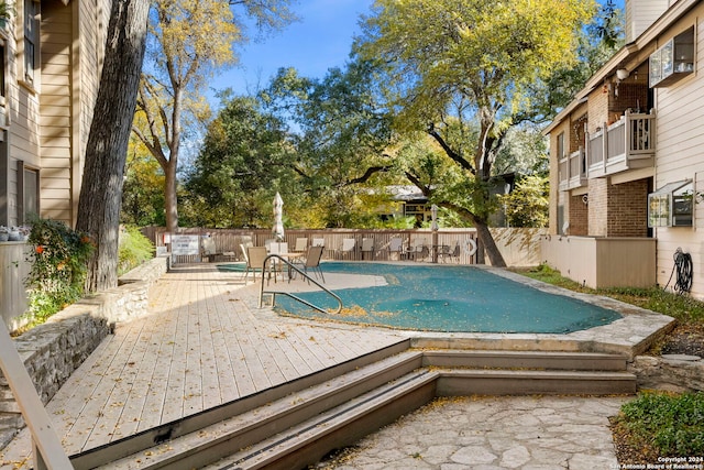 view of pool featuring a wooden deck