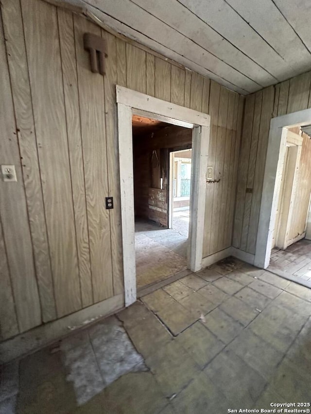 interior space with wood walls and wooden ceiling