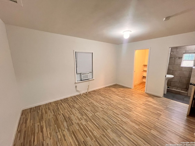 interior space featuring light hardwood / wood-style floors and cooling unit