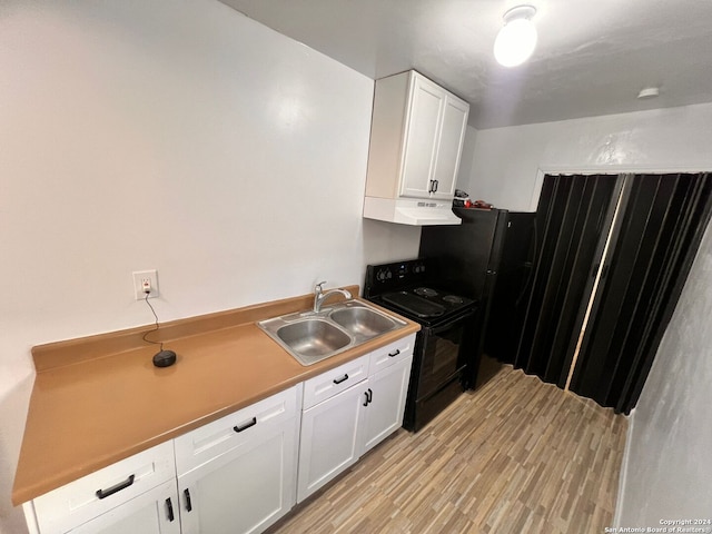 kitchen with white cabinetry, black electric range, exhaust hood, and sink