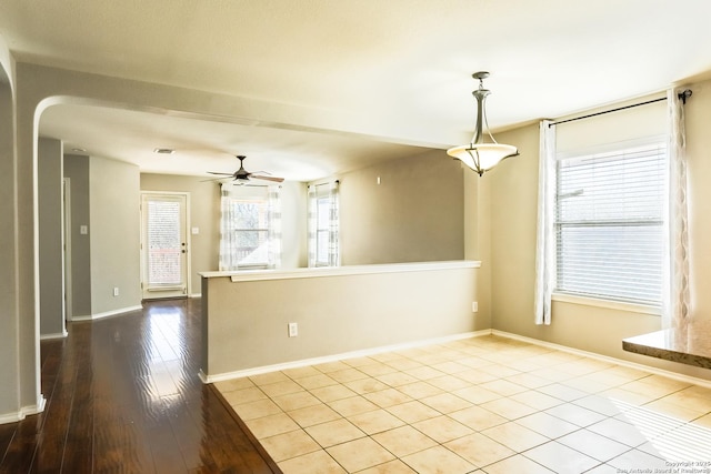 spare room featuring ceiling fan and light hardwood / wood-style floors