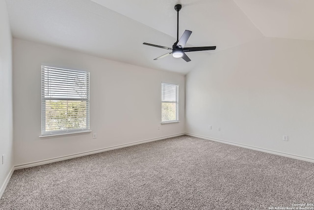 unfurnished room with ceiling fan, carpet floors, and lofted ceiling