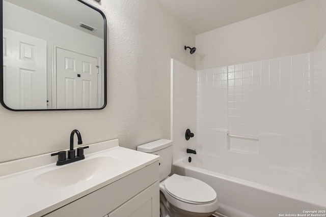 full bathroom featuring vanity,  shower combination, and toilet