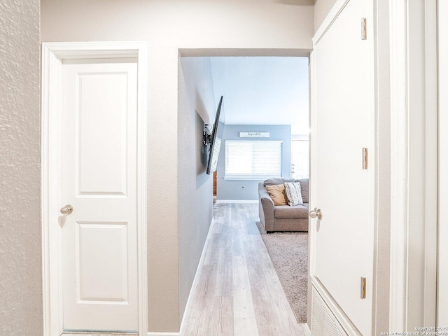 corridor featuring light wood-type flooring