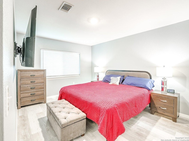 bedroom with light hardwood / wood-style flooring