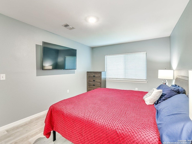 bedroom featuring light hardwood / wood-style floors