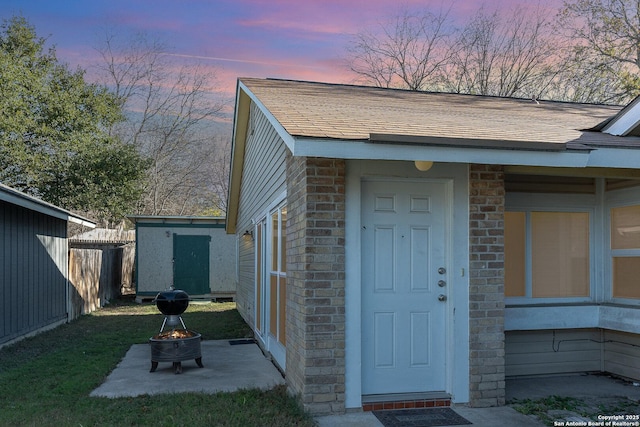 view of exterior entry at dusk