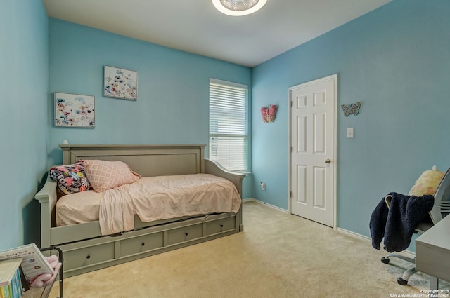 bedroom with light colored carpet