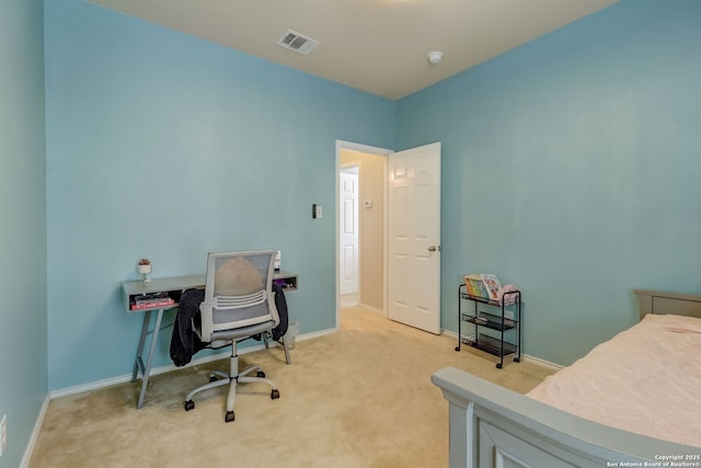 bedroom featuring light carpet