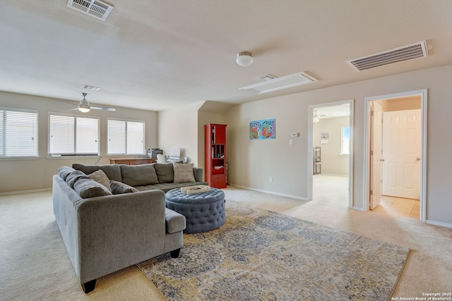 living room with ceiling fan and light carpet