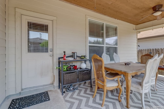 exterior space featuring ceiling fan and wooden ceiling