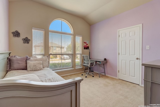 bedroom with light carpet and vaulted ceiling