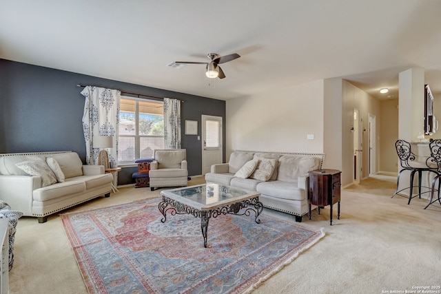 carpeted living room featuring ceiling fan