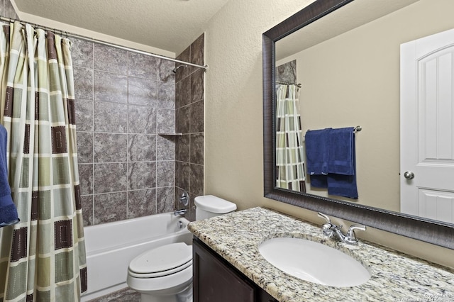 full bathroom with vanity, shower / tub combo, a textured ceiling, and toilet