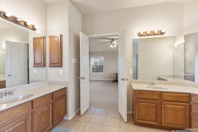 bathroom with ceiling fan, tile patterned flooring, and vanity