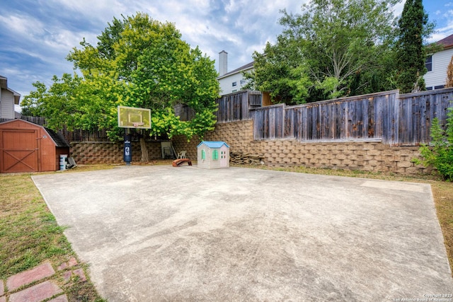 view of patio featuring a storage shed