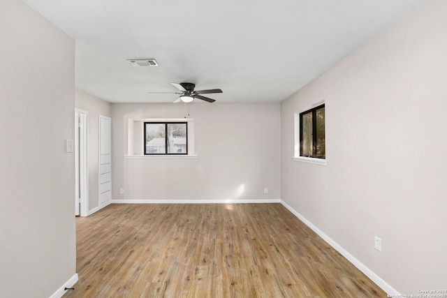 spare room featuring ceiling fan and light hardwood / wood-style floors