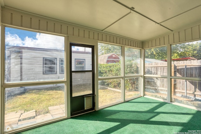 unfurnished sunroom with a wealth of natural light