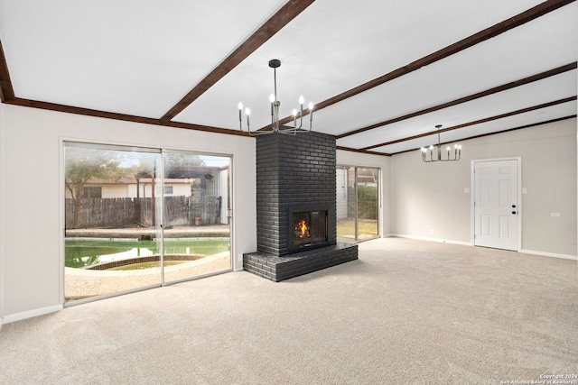 unfurnished living room featuring beam ceiling, carpet floors, a fireplace, and a chandelier