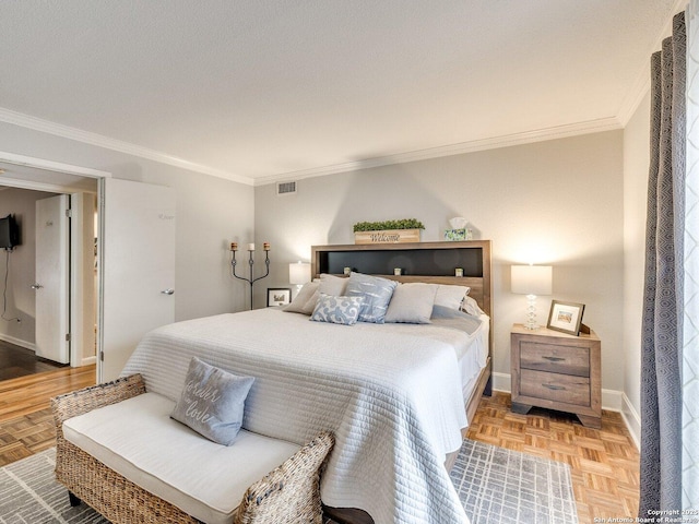 bedroom with light parquet flooring and crown molding