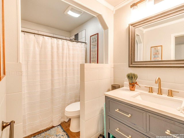 bathroom with vanity, toilet, wood-type flooring, and crown molding