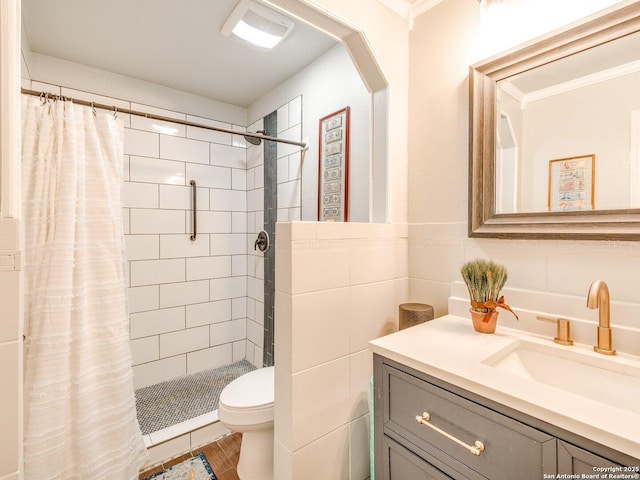 bathroom with toilet, vanity, ornamental molding, and walk in shower