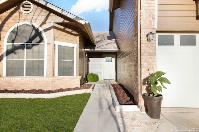 view of exterior entry featuring a garage