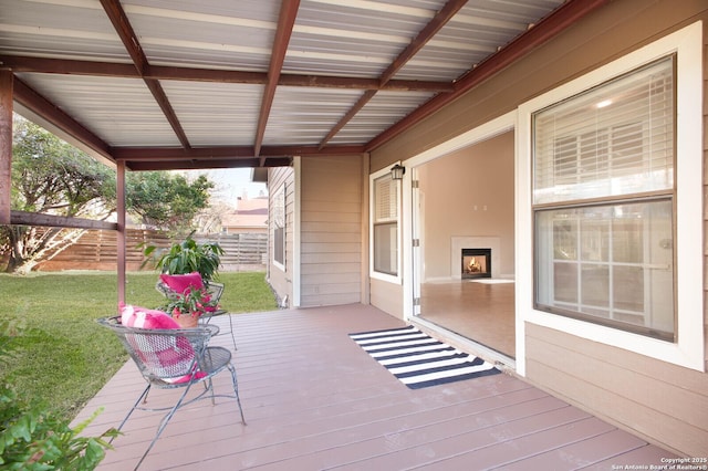 wooden terrace with a yard