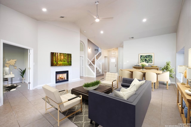 tiled living room featuring ceiling fan and high vaulted ceiling