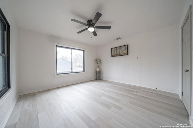 unfurnished room with light hardwood / wood-style floors and ceiling fan