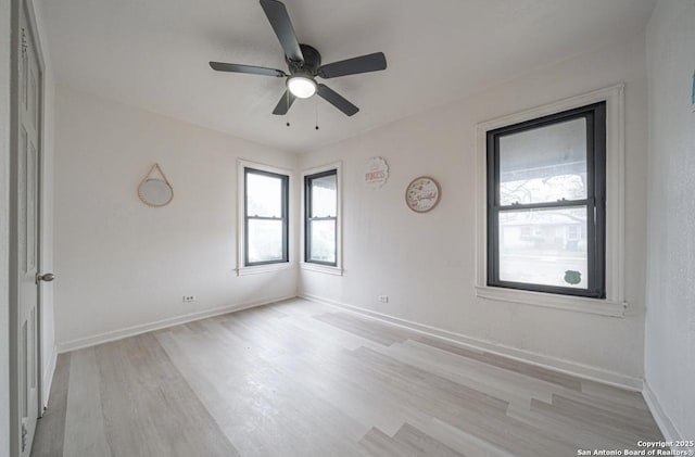 spare room with ceiling fan and light hardwood / wood-style floors