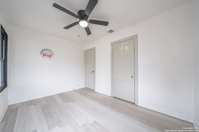 unfurnished bedroom with ceiling fan and light hardwood / wood-style flooring