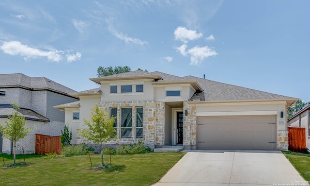 view of front facade featuring a garage and a front yard