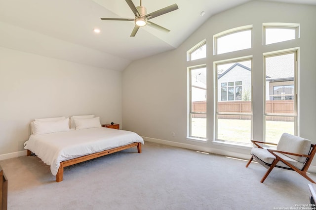 carpeted bedroom featuring ceiling fan and lofted ceiling