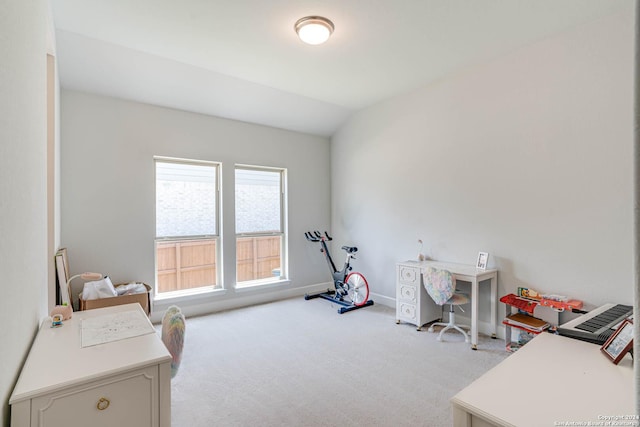 interior space with light colored carpet and lofted ceiling