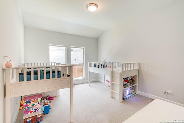 carpeted bedroom featuring vaulted ceiling